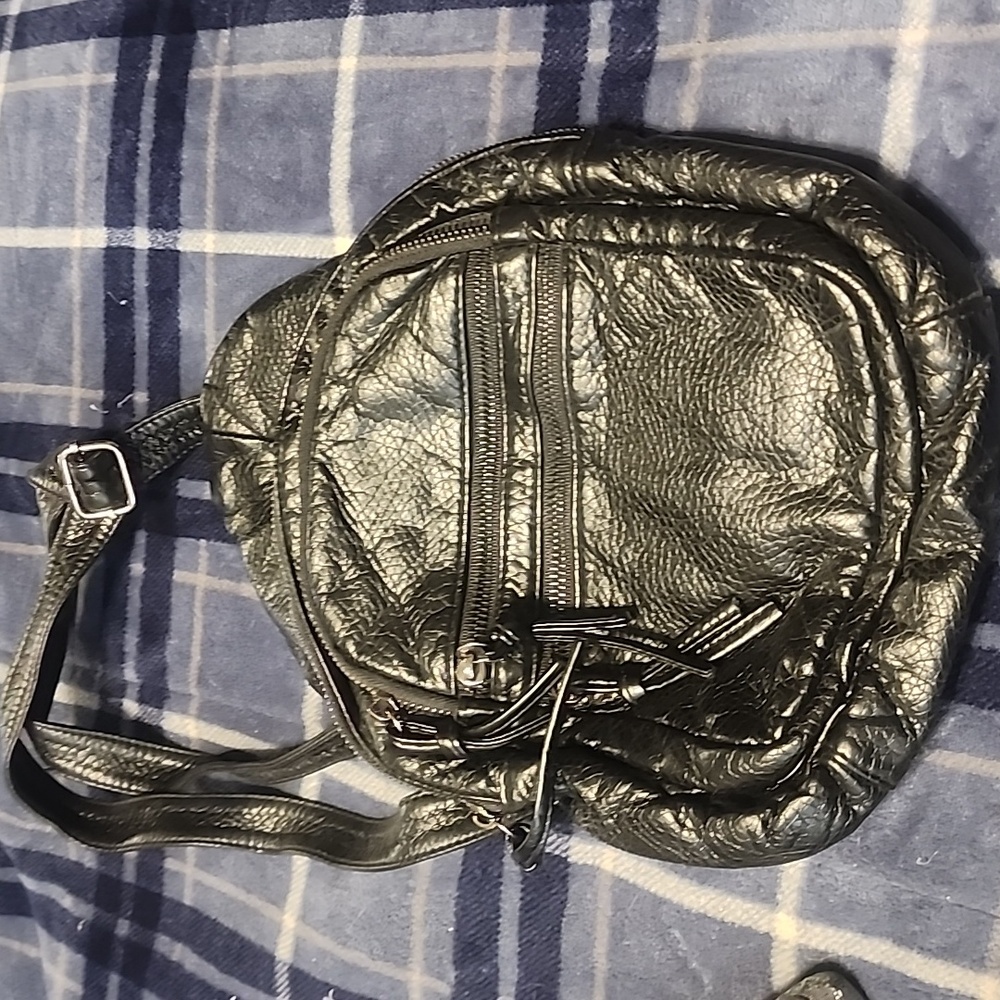 Black backpack sling bag.